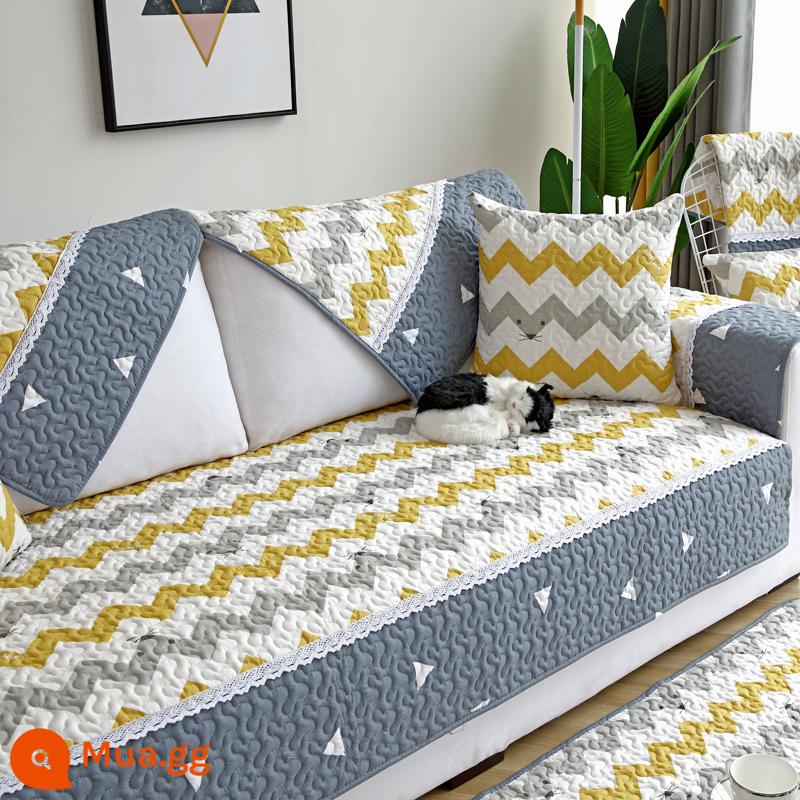 Đệm sofa bông chống trượt giá đặc biệt vải cotton nguyên chất bốn mùa hiện đại đơn giản bao trọn gói giải phóng mặt bằng phổ khăn khăn đệm ghế - gợn sóng màu vàng