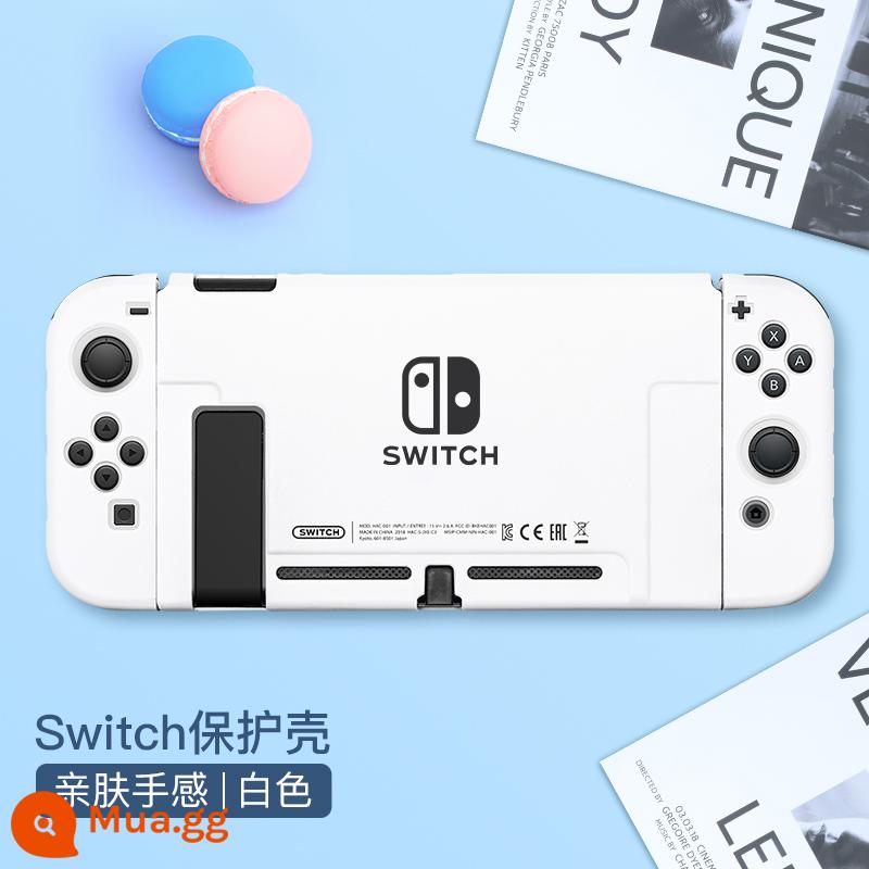 Chính thức Nintendo switcholed vỏ bảo vệ công tắc tay cầm vỏ ns vỏ cứng đế có thể cắm vỏ trong suốt vỏ oled túi lưu trữ bộ phụ kiện silicone mềm vỏ mềm riêng biệt tay áo silicone - Switch thân thiện với làn da vỏ "trắng" đi kèm màng + nắp