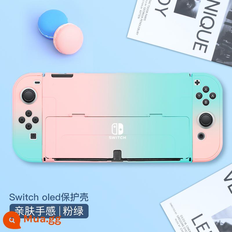 Chính thức Nintendo switcholed vỏ bảo vệ công tắc tay cầm vỏ ns vỏ cứng đế có thể cắm vỏ trong suốt vỏ oled túi lưu trữ bộ phụ kiện silicone mềm vỏ mềm riêng biệt tay áo silicone - Vỏ chuyển đổi thân thiện với da "gradient màu xanh hồng" đi kèm với màng + nắp