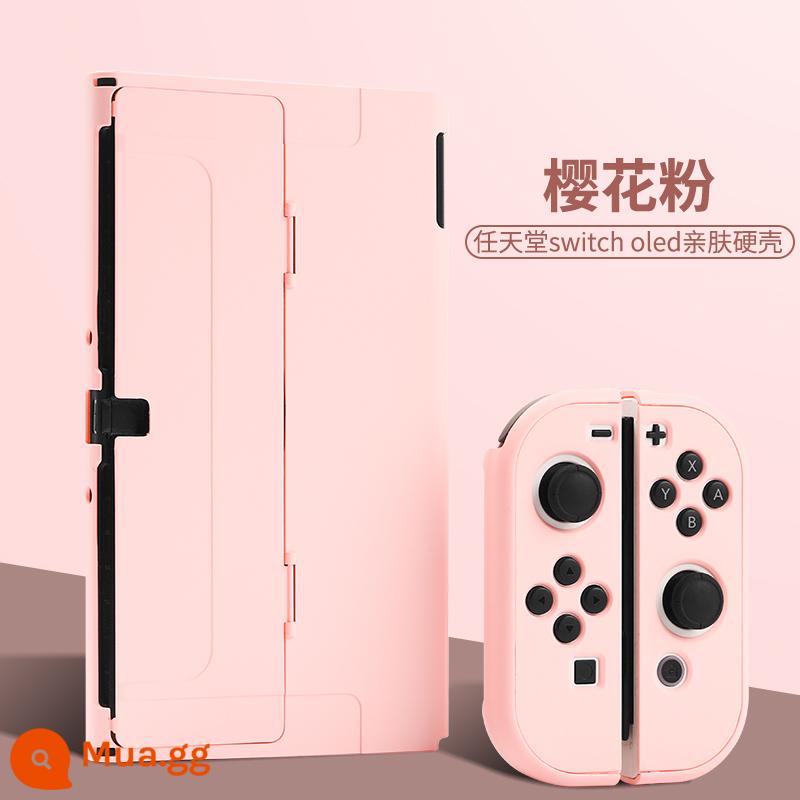 Vỏ bảo vệ Nintendo Switch Vỏ tay cầm switcholed vỏ silicon mềm cho máy trò chơi ns Vỏ silicon vỏ màn hình oled riêng biệt vỏ cứng hai mảnh trong suốt tích hợp máy bay chiến đấu phản lực 3 phụ kiện - switcholed [vỏ cứng thân thiện với da màu hồng sakura] miễn phí phim + nắp