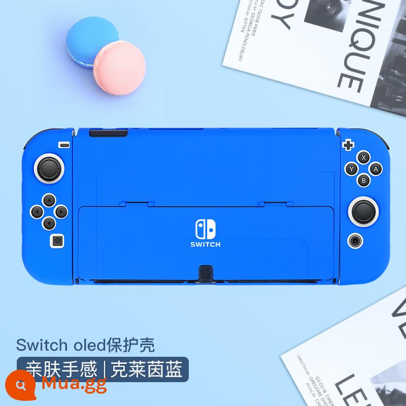 Chính thức Nintendo switcholed vỏ bảo vệ công tắc tay cầm vỏ ns vỏ cứng đế có thể cắm vỏ trong suốt vỏ oled túi lưu trữ bộ phụ kiện silicone mềm vỏ mềm riêng biệt tay áo silicone - Vỏ thân thiện với da chuyển đổi "Klein Blue" đi kèm màng + nắp