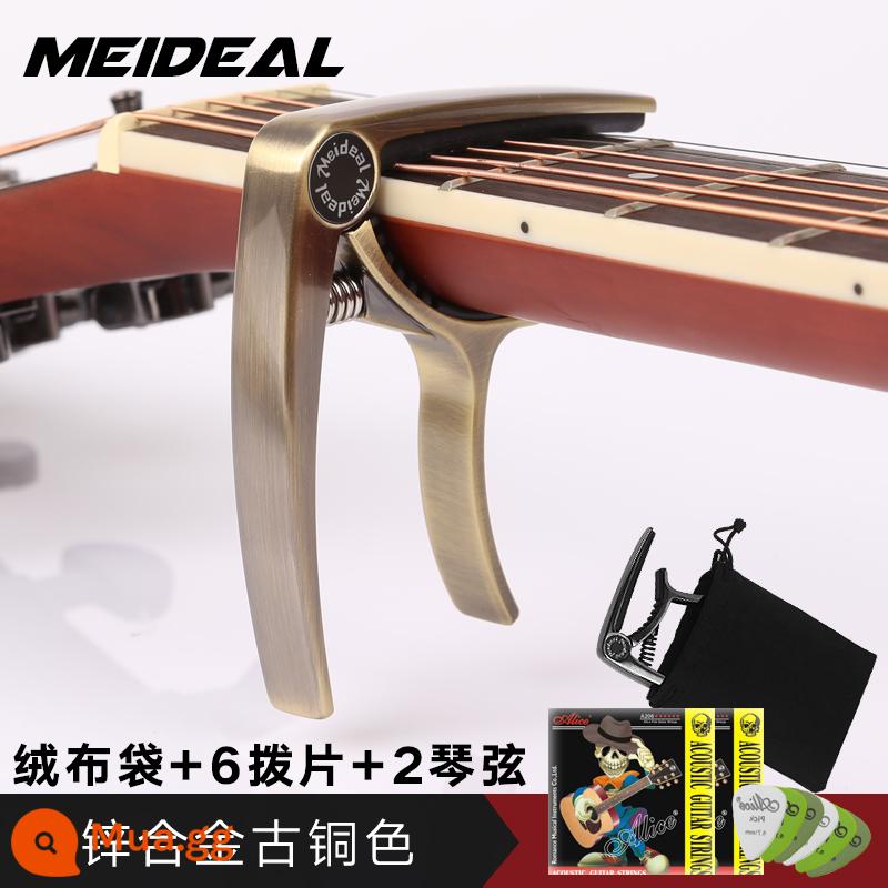 Cao cấp khắc dân gian đàn guitar chuyển vị clip kép ukulele đổi chỉnh clip chuyển vị phụ kiện đàn guitar - Capo kim loại màu đồng mờ MC10 [đi kèm túi nhung + 1 dây + 2 dây + pick*6]