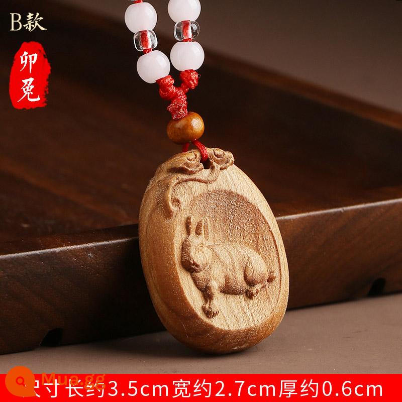 Gỗ gụ mười hai cung hoàng đạo handmade khắc gỗ móc chìa khóa ô tô mặt dây chuyền năm cung hoàng đạo mặt dây chuyền thỏ pika ngựa cừu gà bò chó rồng - Mặt dây chuyền Thỏ hoàng đạo bằng gỗ đào chạm khắc tinh xảo (Loại B)