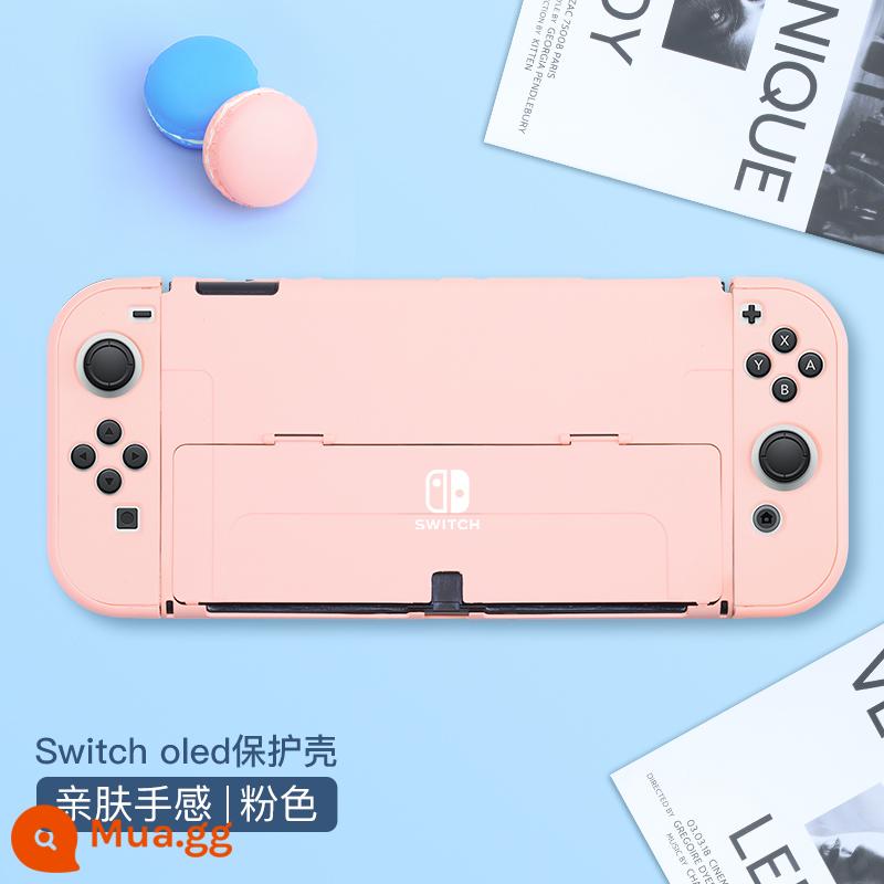 Chính thức Nintendo switcholed vỏ bảo vệ công tắc tay cầm vỏ ns vỏ cứng đế có thể cắm vỏ trong suốt vỏ oled túi lưu trữ bộ phụ kiện silicone mềm vỏ mềm riêng biệt tay áo silicone - Vỏ thân thiện với da có thể chuyển đổi "Sakura Pink" đi kèm với màng + nắp