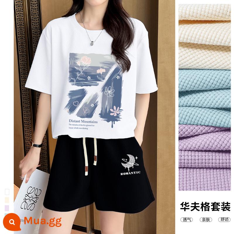 Bộ quần áo thể thao Jeanswest LIFE quần áo mùa hè nữ 2023 mới rộng rãi quần short ngắn tay hai mảnh giản dị thủy triều mùa hè - [Phiên bản dài vừa phải] Trắng - sơn dầu graffiti + [quần ba phần tư] đen - Xingyue k