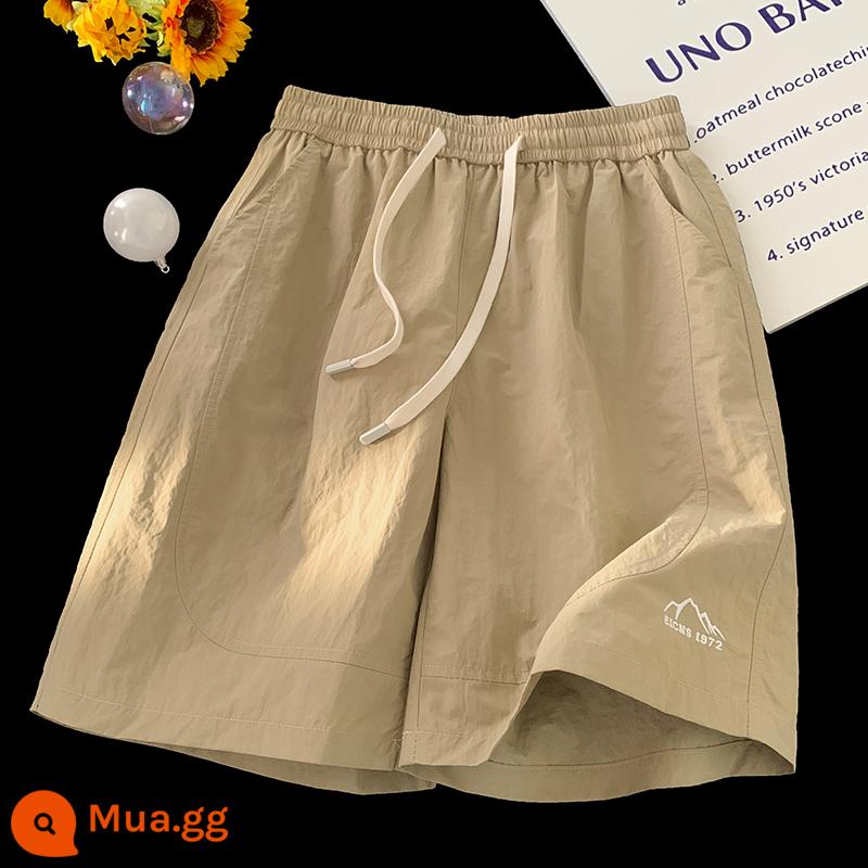 Quần short đi biển thoáng khí nhanh khô màu tím dành cho nữ thiết kế ống rộng ống rộng thể thao mang phong cách retro Mỹ quần năm điểm mùa hè - Khaki