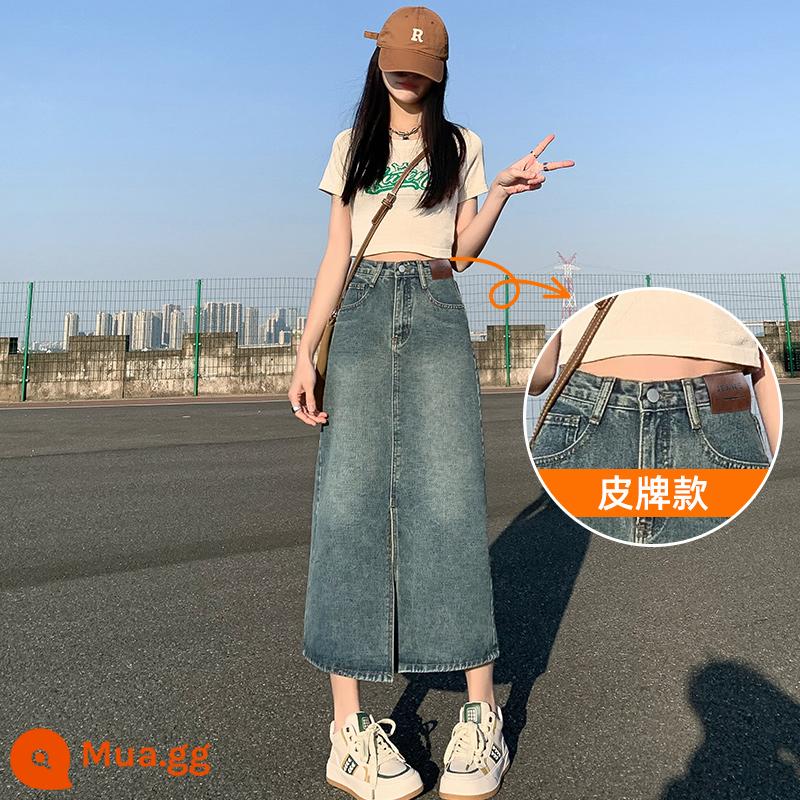 Váy denim lưng cao xẻ tà nữ mùa hè mới 2023 váy chữ A gói váy hông váy hình quả lê nhỏ - Thương hiệu da/màu xanh retro