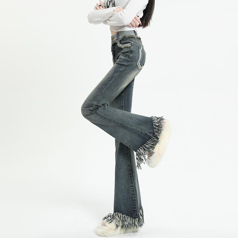 Quần jeans cạp trễ dành cho nữ mùa xuân hè với thiết kế nóng bỏng, tua rua, lưng cao, thon gọn, co giãn, viền thô retro, quần lau sàn móng ngựa.