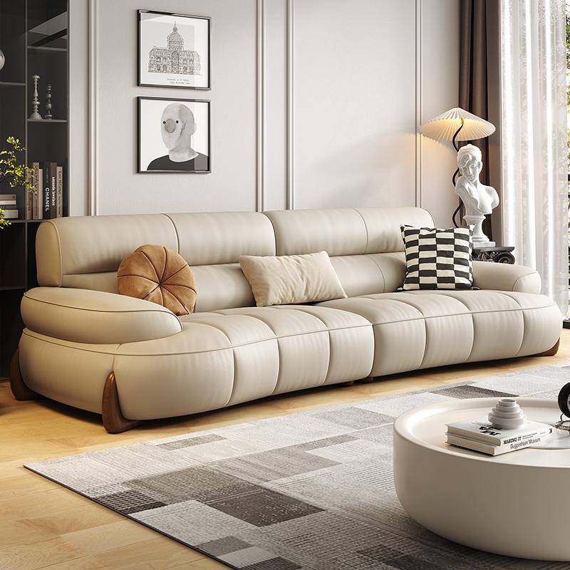 Sofa da Carlsle phong cách kem phòng khách căn hộ nhỏ ánh sáng sang trọng hiện đại lớn ngồi sâu phím đàn piano sofa da cong